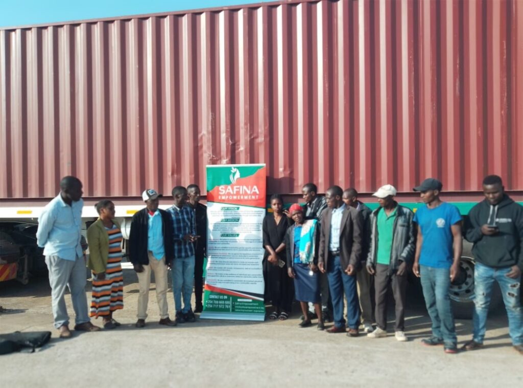 Safina team beside a resource distribution shipment