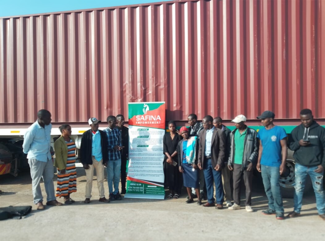 Safina team beside a resource distribution shipment